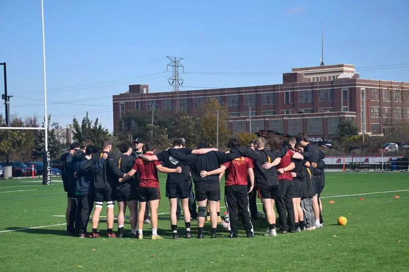 Loyola Rugby huddle near the Chicago skyline